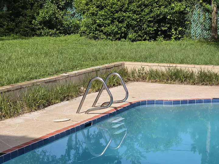 Residential pool edge and waterline detail after the interior finish work.